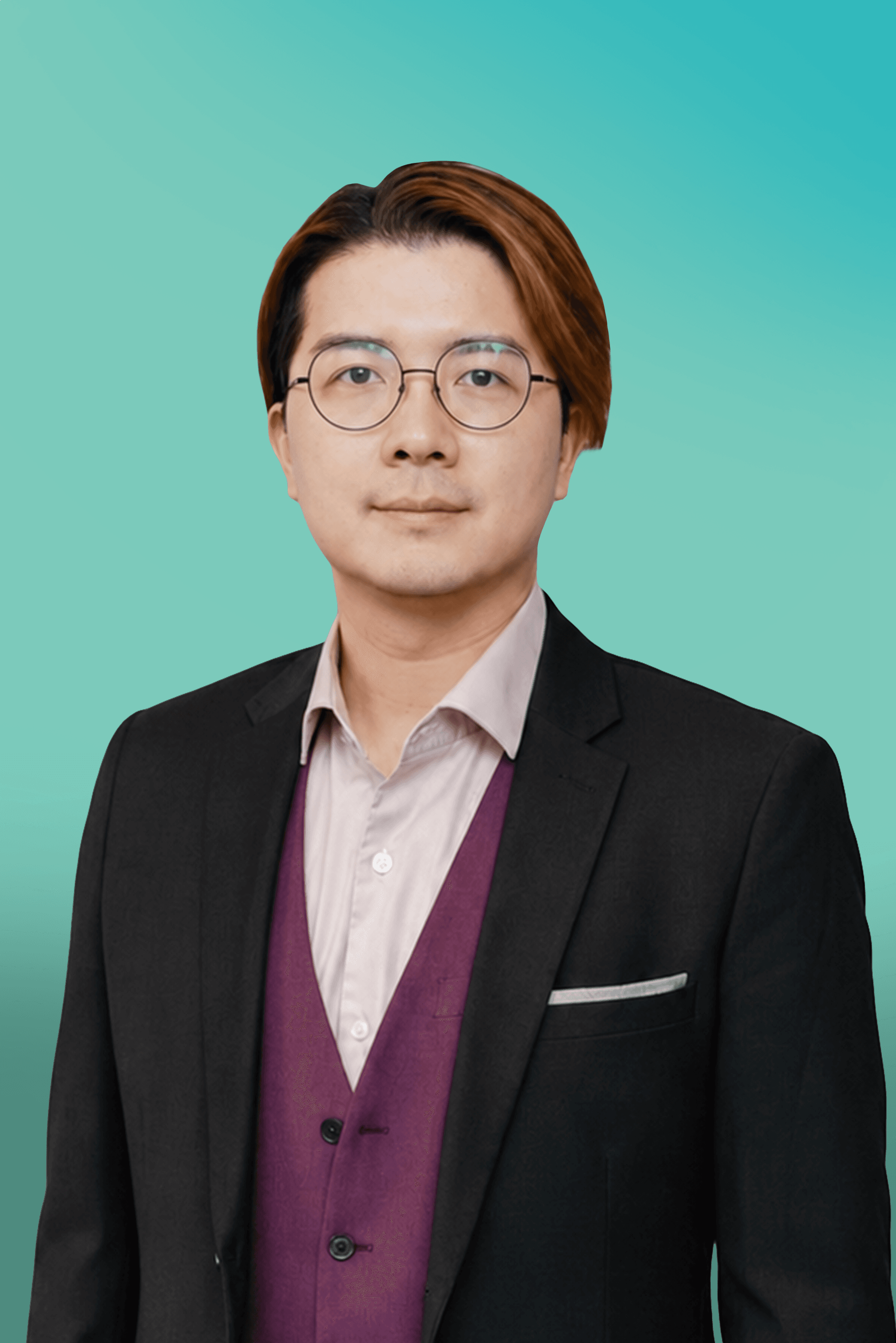 Professional Asian man with glasses wears a black suit and purple vest.