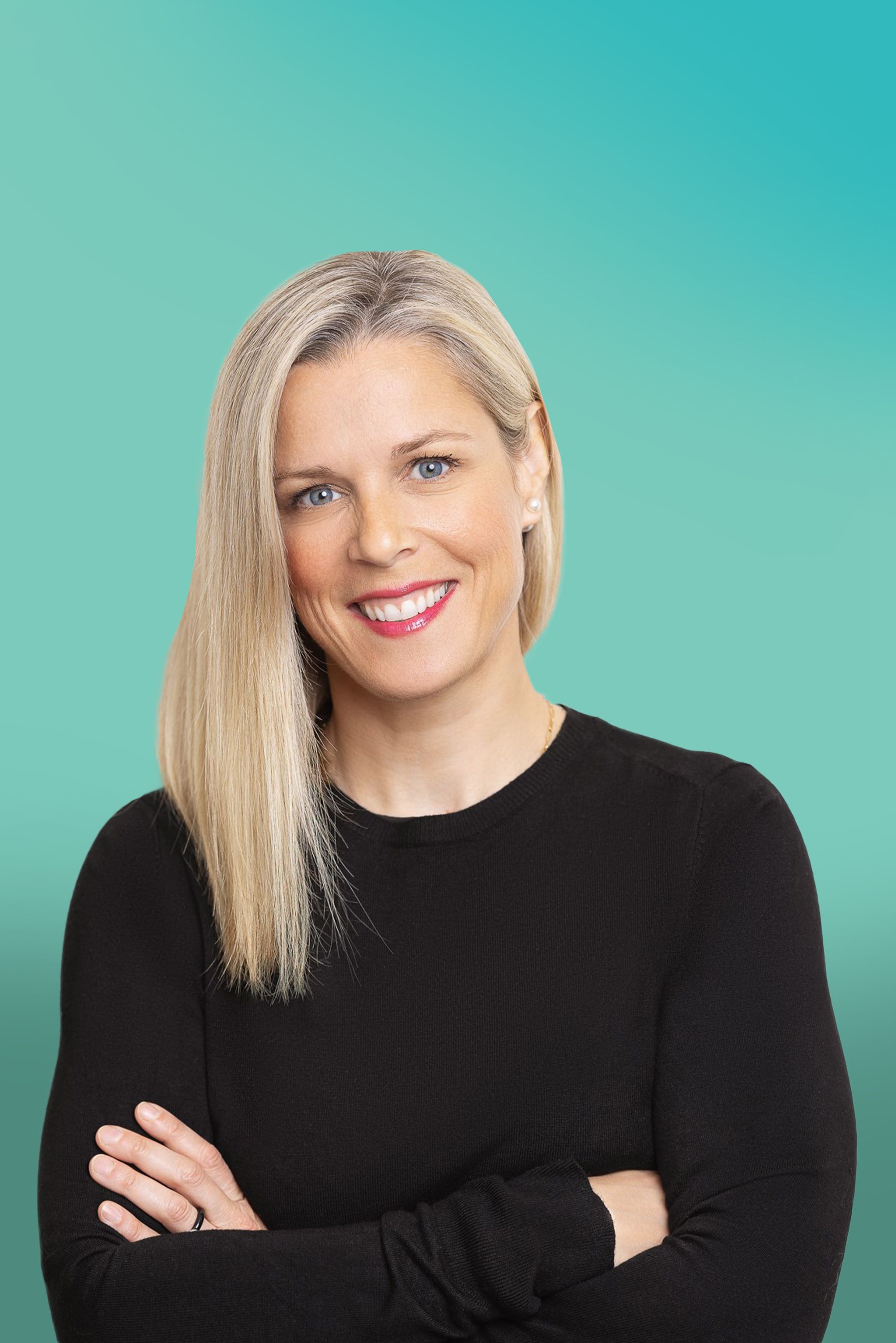 Professional blonde woman in black top with crossed arms smiles against a teal background.