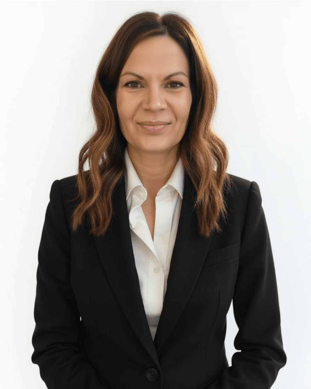 Professional woman with long brown hair wearing a black suit jacket and white shirt.