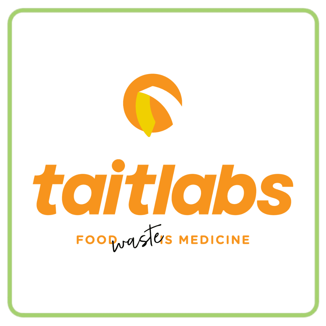 Taitlabs logo: orange text, icon, and 'FOOD WASTERS MEDICINE' slogan with 'WASTERS' crossed out.